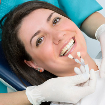 Smiling woman lying in a dental chair